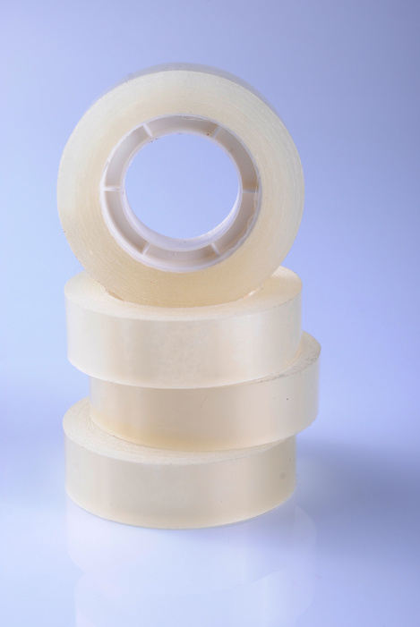 Transparent scotch tape rolls in a stack
